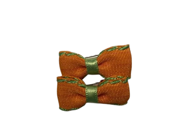 look company 2 oranje speldjes in vorm van strikjes 